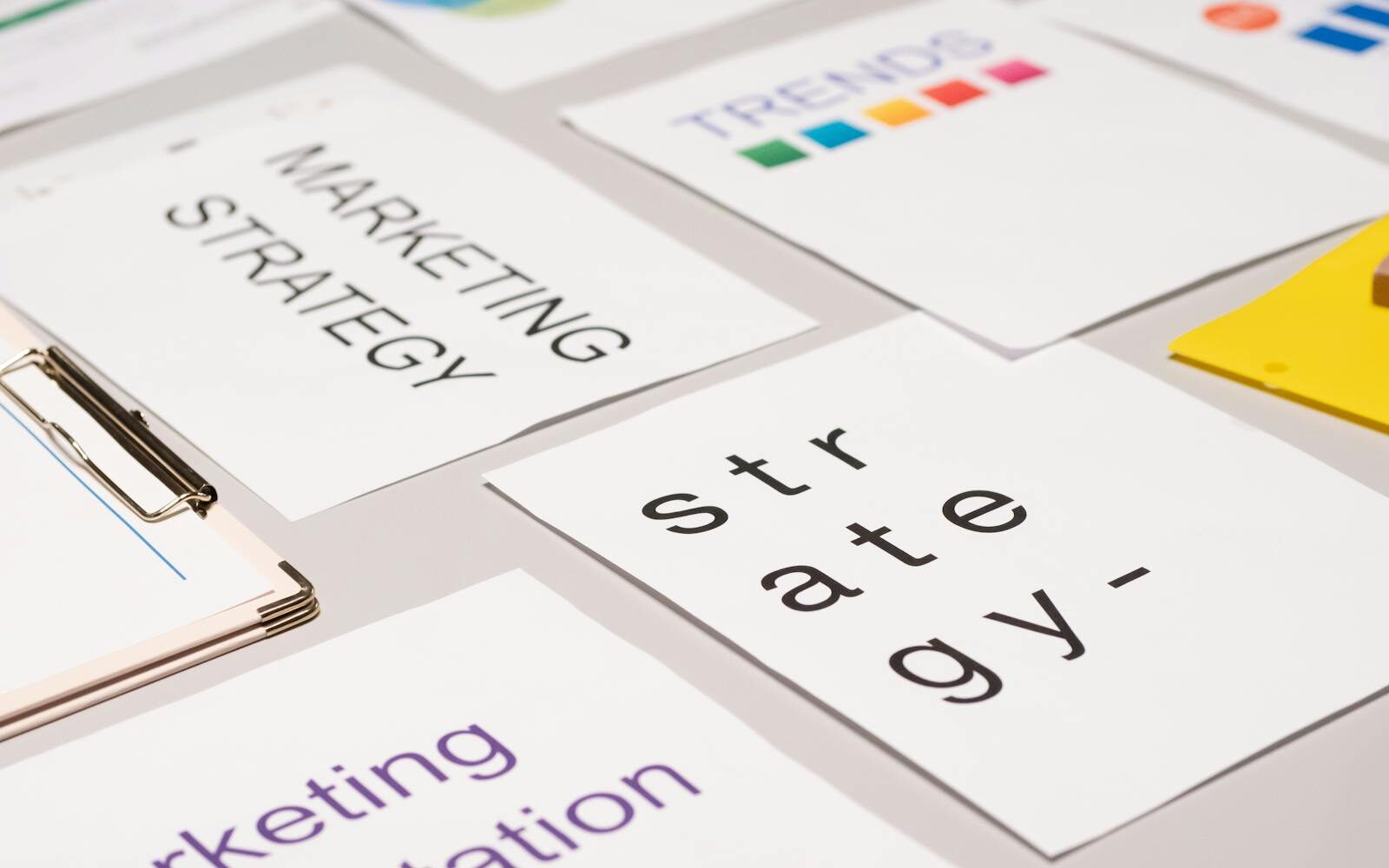 A top view of marketing strategy documents and graphs arranged on a desk, showcasing business planning.