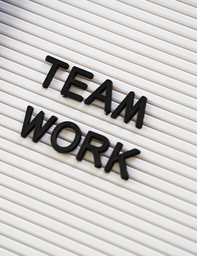 a sign that says team work on it