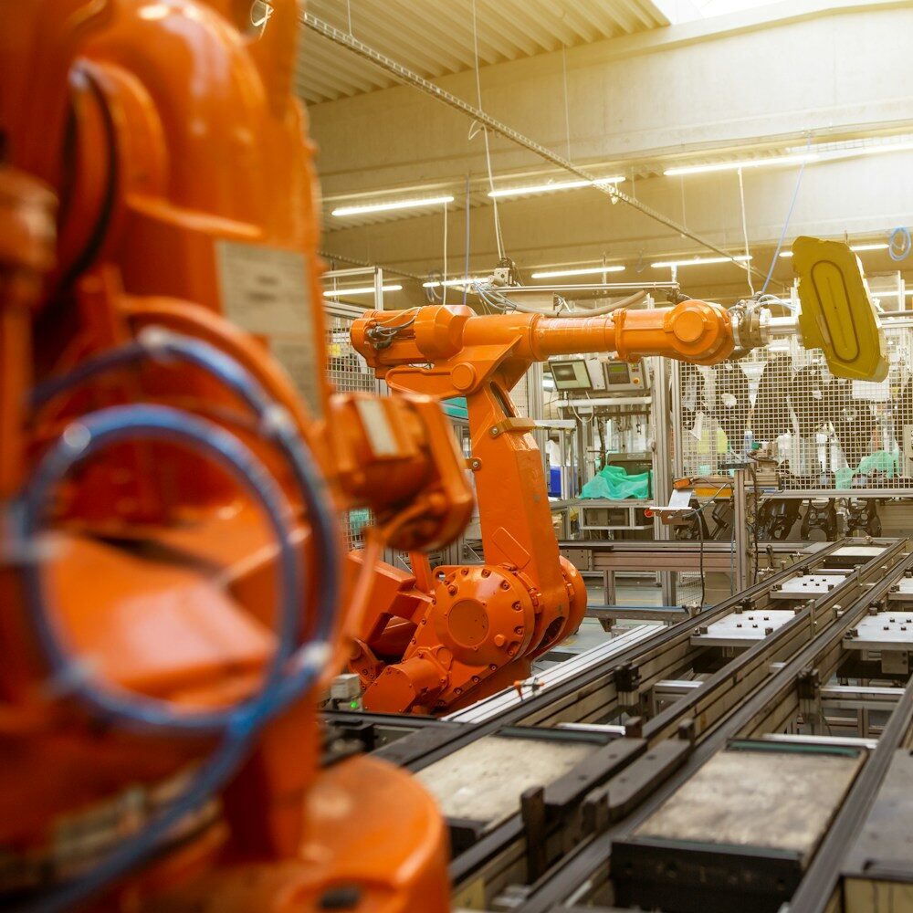 a factory filled with lots of orange machines
