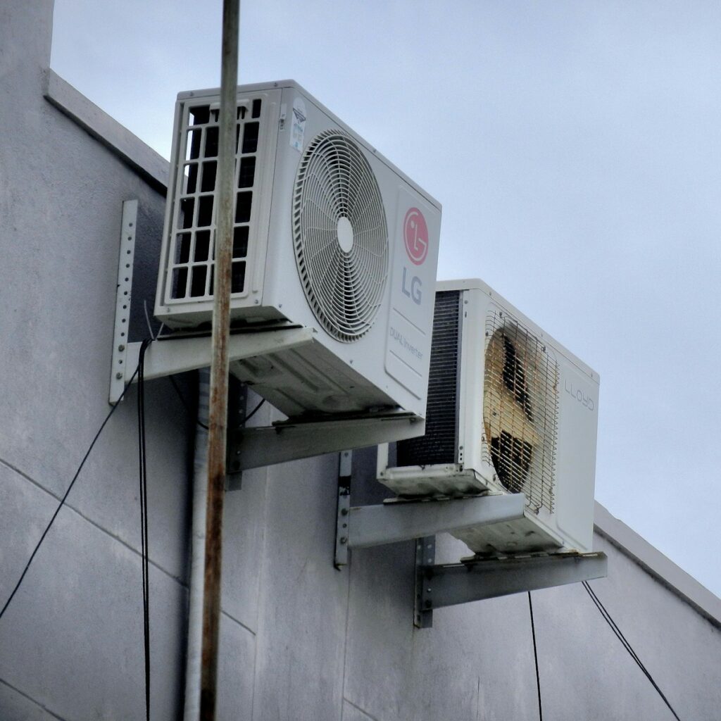 An air conditioner mounted to the side of a building
